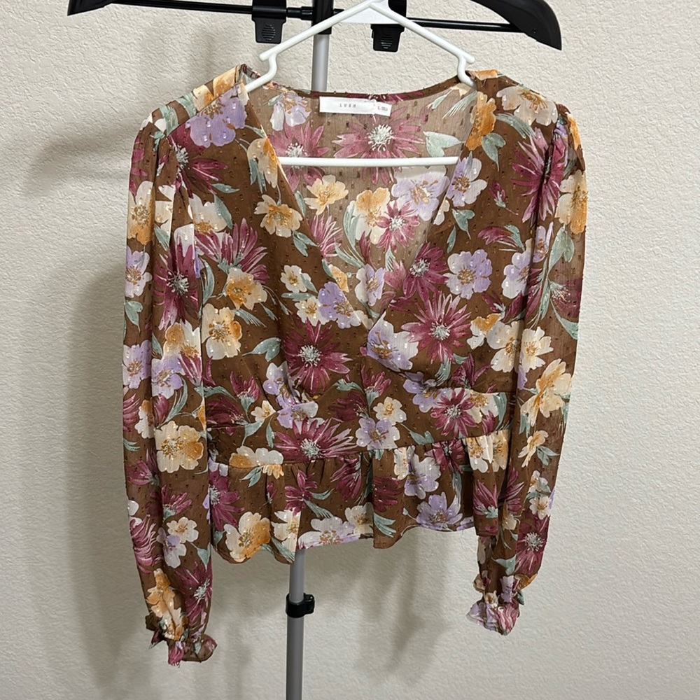 Beautiful floral blouse with the perfect amount of cleavage!